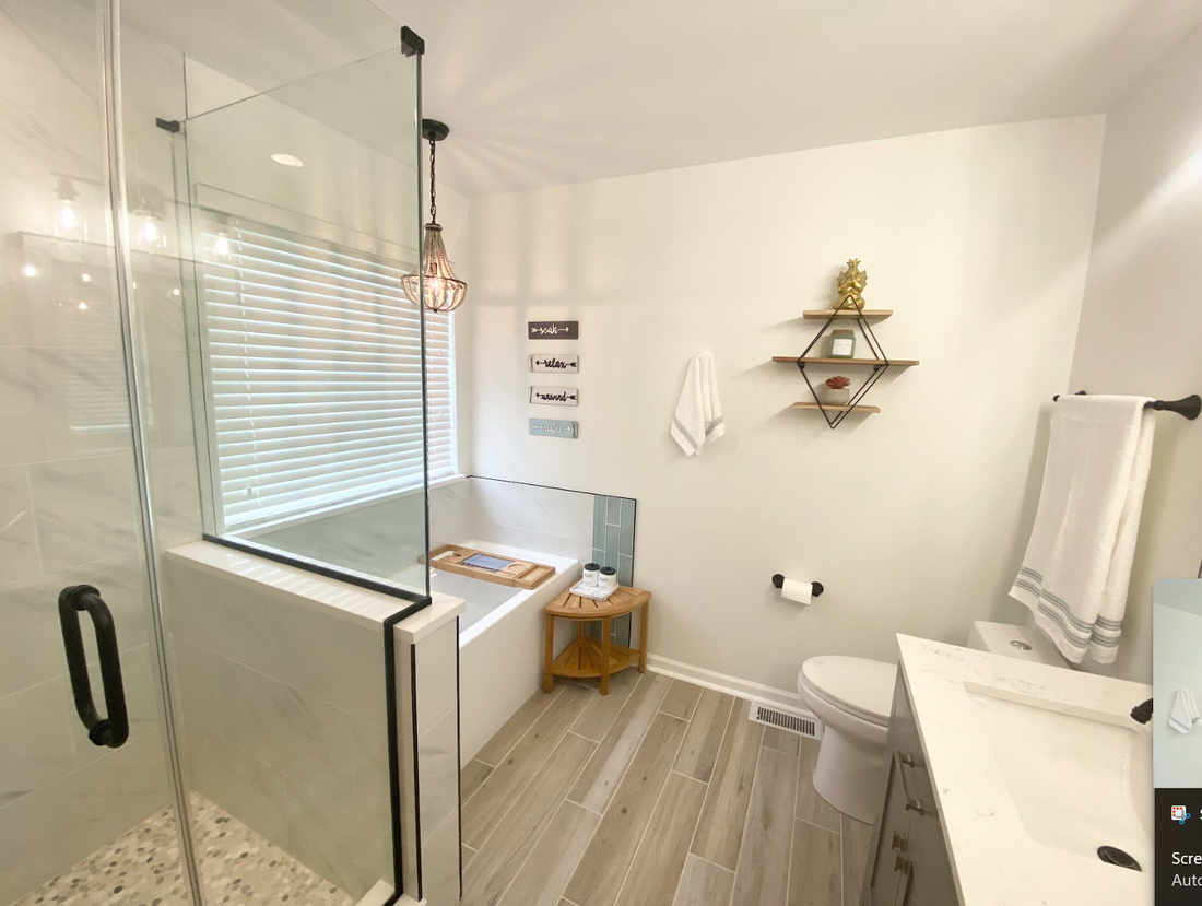 Renovated bathroom with modern fixtures and elegant design.