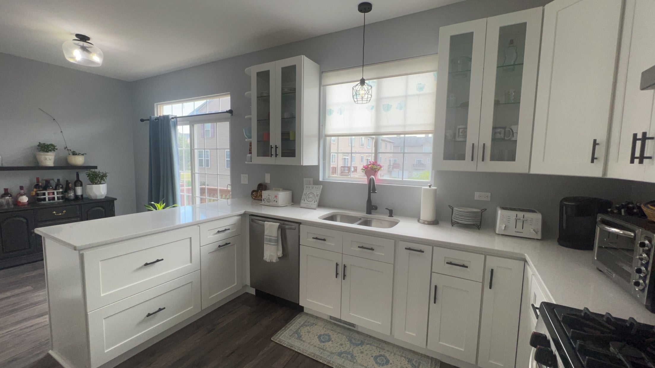 White Shaker Cabinets, Natural Lighting, Glass cabinets, Black hardware, Lake Forest Kitchens
