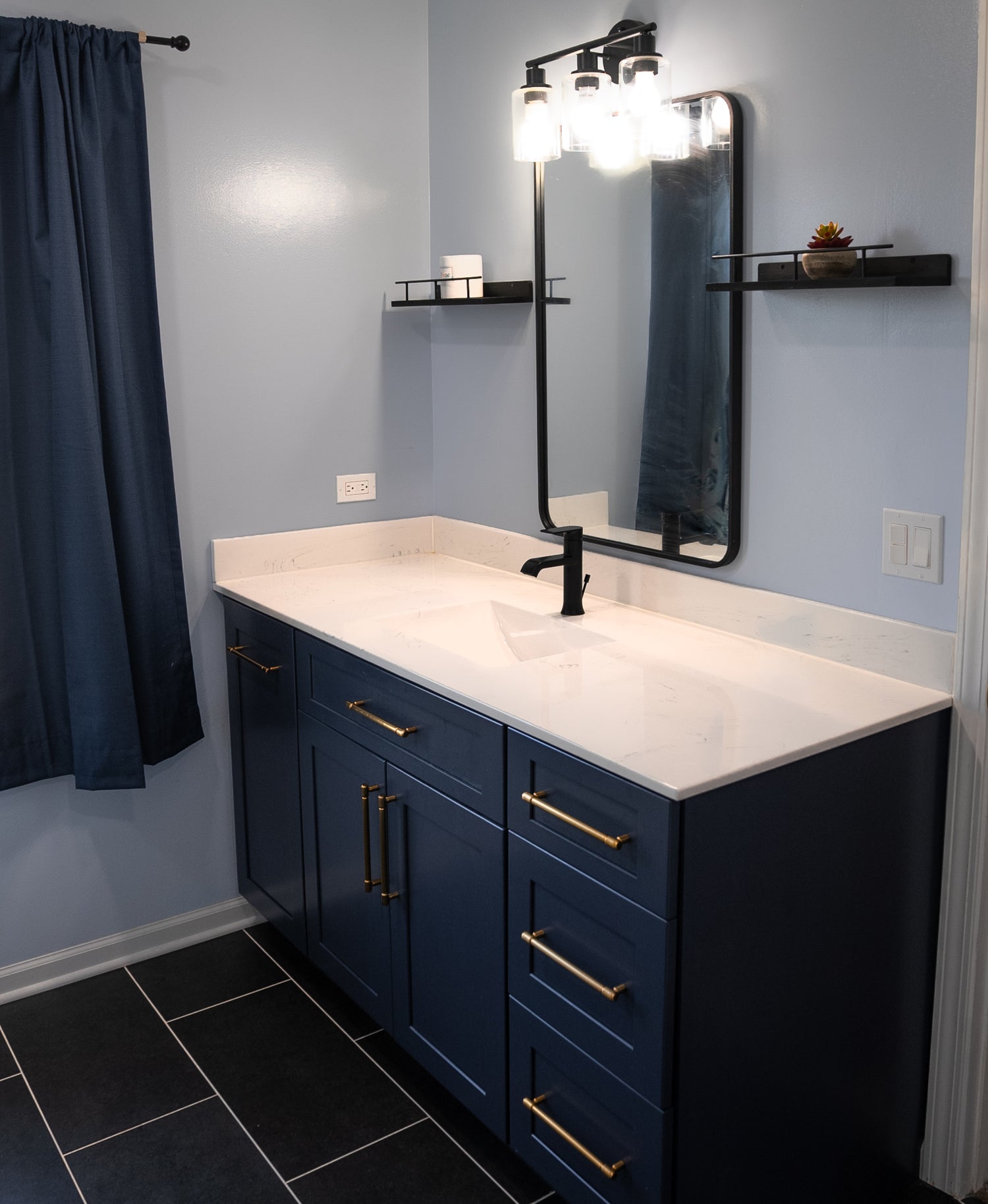 Luxury bathroom featuring heated floors, quartz countertops, custom lighting, and premium fixtures, creating a spa-like experience.