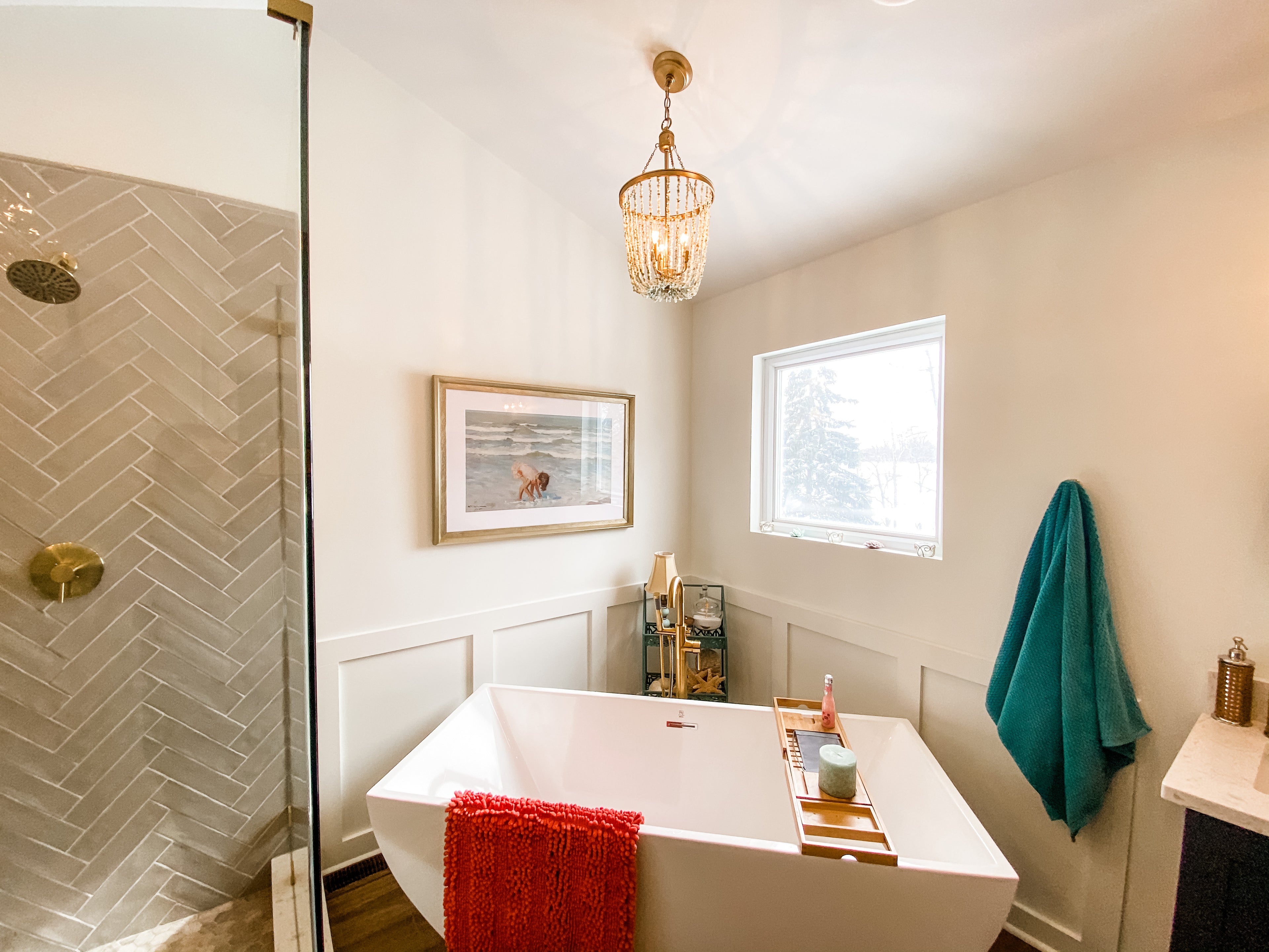 Modern bathroom with custom layout, featuring a freestanding tub, stylish vanity, and elegant tile work showcasing personalized design.